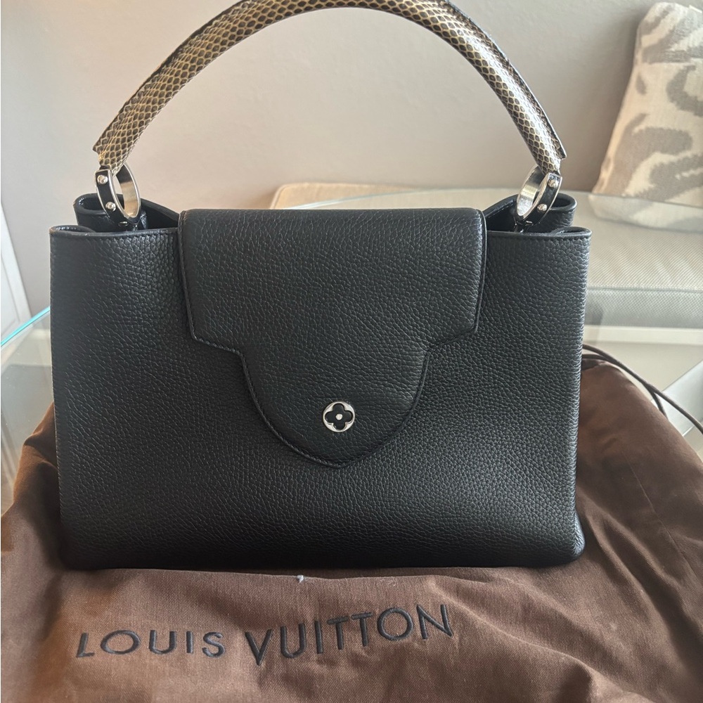 Louis Vuitton Capucine handbag with water snake trim handle